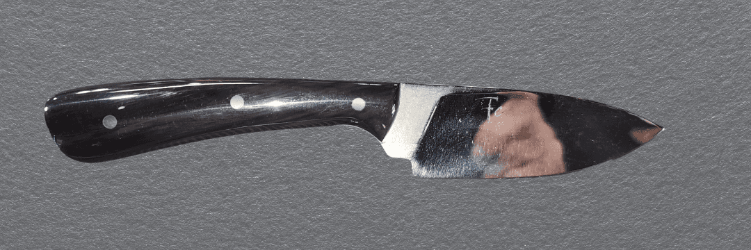 Custom blade showing distinctive steel finish