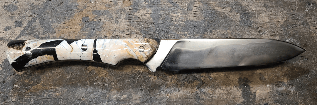 Mosaic Laminate Damascus — intricate intentional pattern forged into the steel